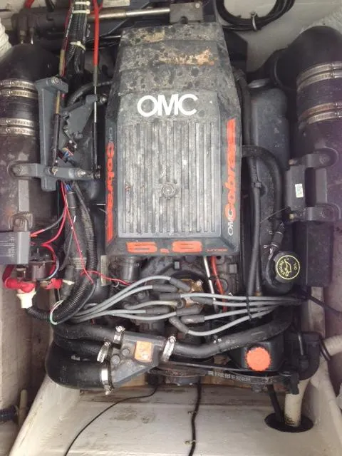 Slide: The Image of Engine of a 1992 Chris-Craft 232 Crowne boat, featuring OMC Cobra 5.8 components. - 9