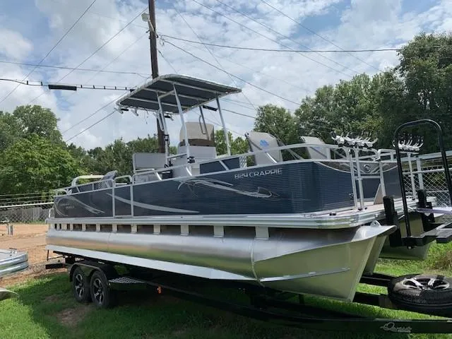The Image of 2019 Angler Qwest 824 Crappie Edition pontoon boat on trailer, side view. - 0