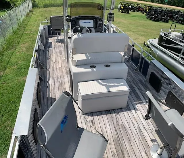 Slide: The Image of 2019 Angler Qwest 824 Crappie Edition boat interior with seating and steering console. - 4