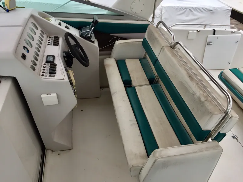 Slide: The Image of 1993 Regal 300 Commodore boat cockpit with dual seating and control panel. - 3