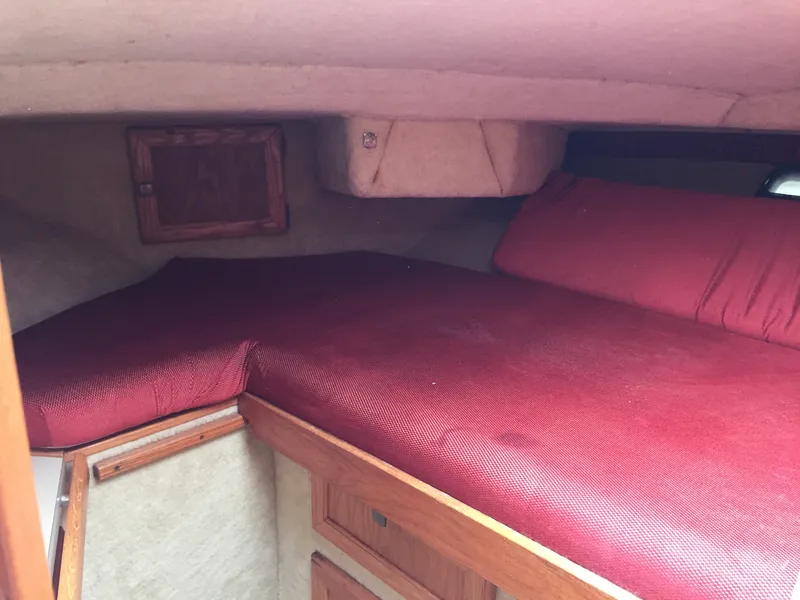 Slide: The Image of Interior cabin of 1981 Bayliner 3250 Conquest Sunbridge with red bedding. - 12