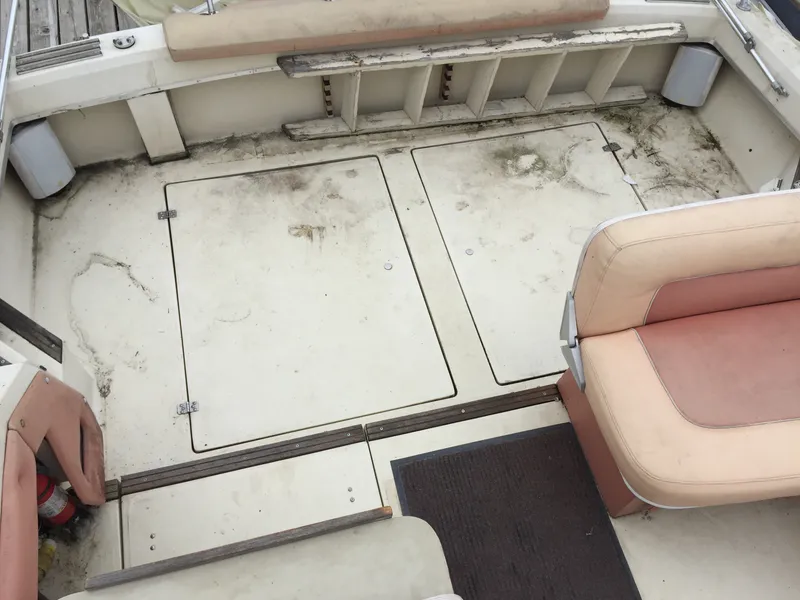 Slide: The Image of 1981 Bayliner 3250 Conquest Sunbridge deck with seating and storage compartments. - 2