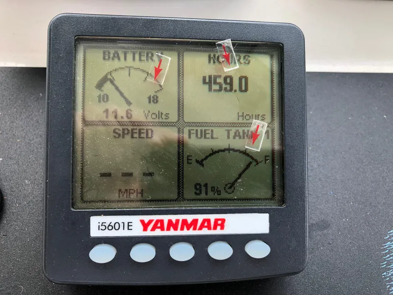Slide: The Image of Yanmar i5601E display showing battery voltage, engine hours, and fuel tank level on a 2008 Back Cove 29. - 14