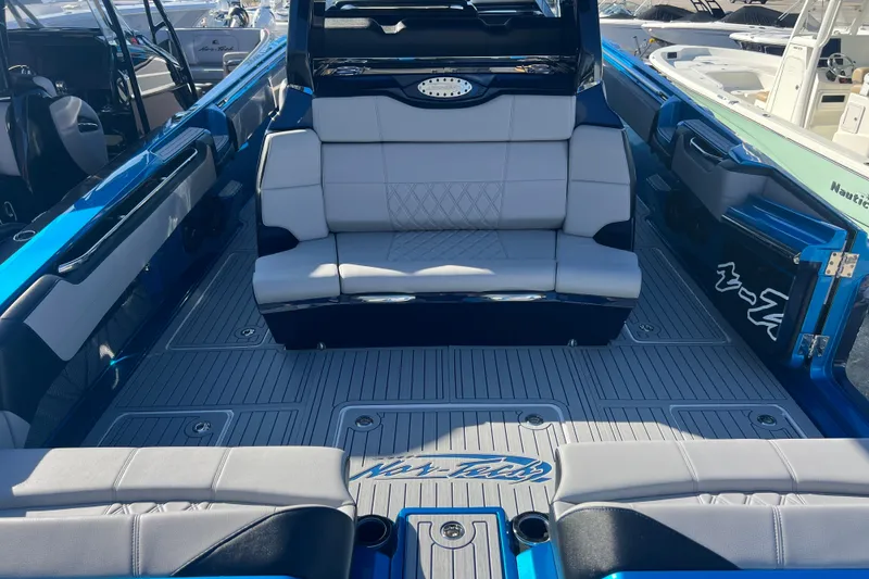 Slide: The Image of 2026 Nor-Tech 450 Sport boat interior with luxurious seating and sleek design. - 11
