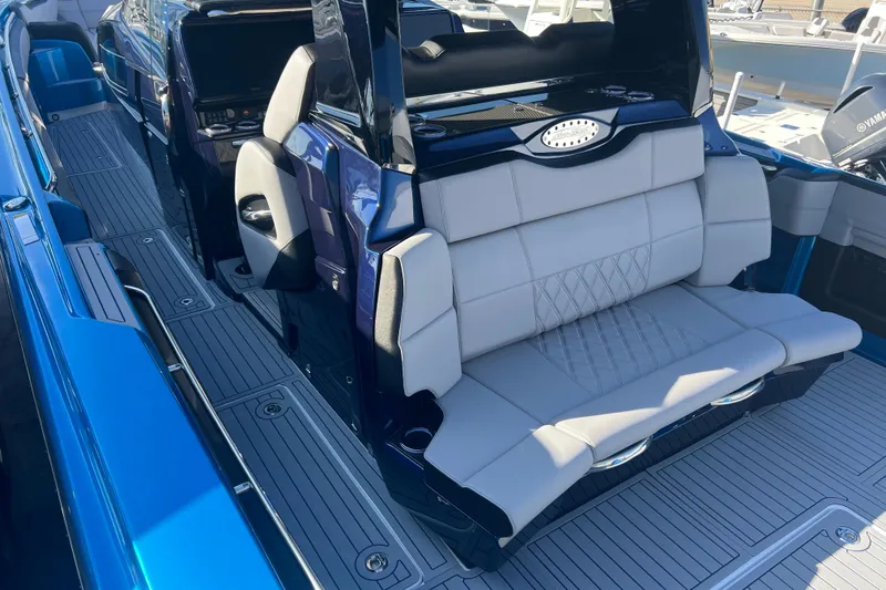 Slide: The Image of 2026 Nor-Tech 450 Sport boat interior with luxurious seating and sleek design. - 12