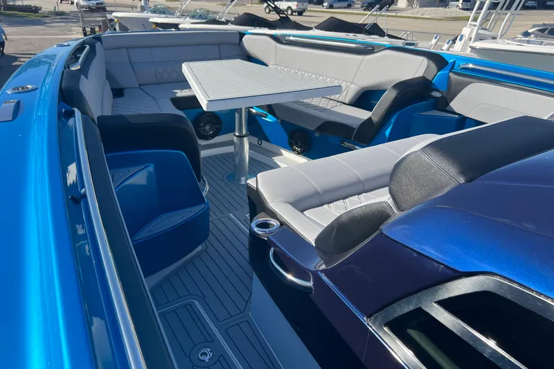 Slide: The Image of Luxurious interior of 2026 Nor-Tech 450 Sport boat with sleek seating and table. - 17