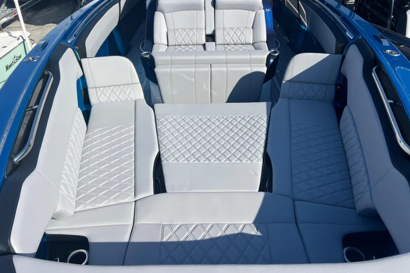 Slide: The Image of Luxurious seating in 2026 Nor-Tech 450 Sport boat with quilted upholstery. - 20
