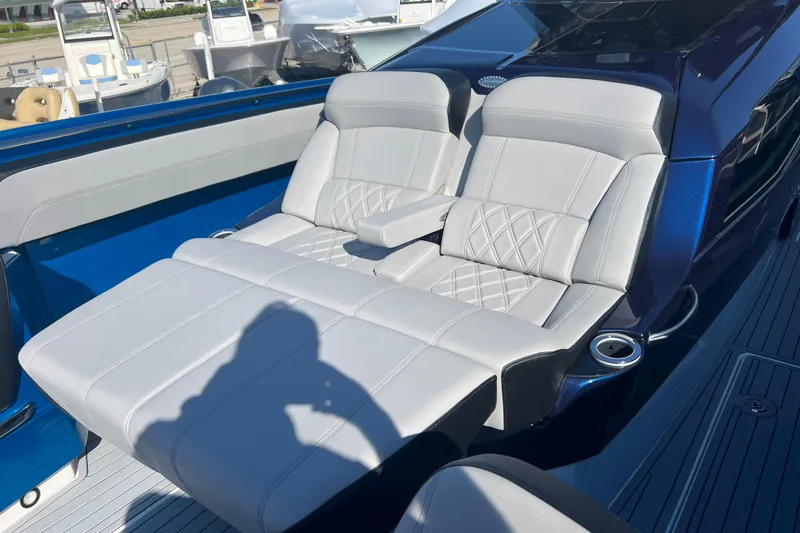 Slide: The Image of Luxurious seating on 2026 Nor-Tech 450 Sport boat, featuring elegant white upholstery. - 22
