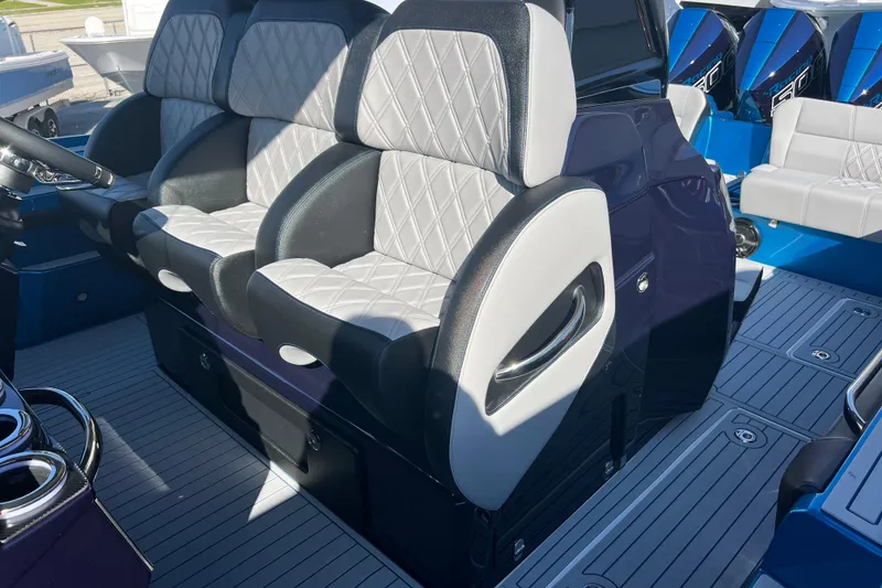 Slide: The Image of Luxury seating on 2026 Nor-Tech 450 Sport boat with quilted upholstery and sleek design. - 23