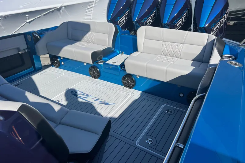 Slide: The Image of 2026 Nor-Tech 450 Sport boat interior with luxurious seating and powerful engines. - 26