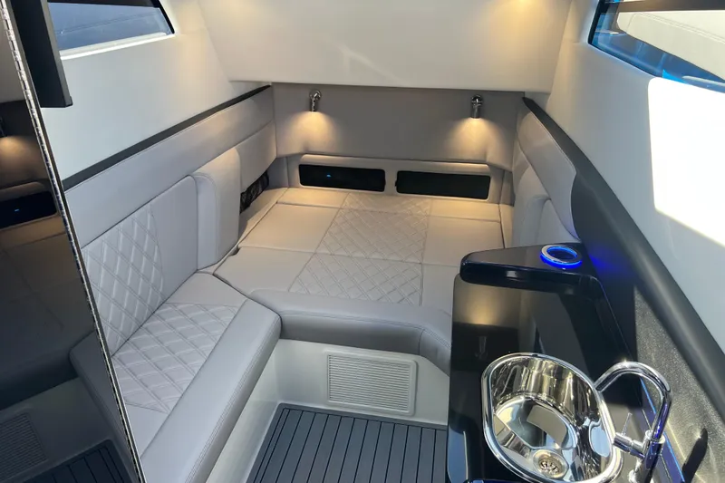 Slide: The Image of Luxurious interior of 2026 Nor-Tech 450 Sport boat with elegant seating and modern amenities. - 31