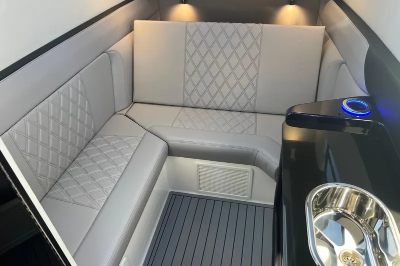 Slide: The Image of Luxurious interior of 2026 Nor-Tech 450 Sport boat with elegant seating and modern amenities. - 32
