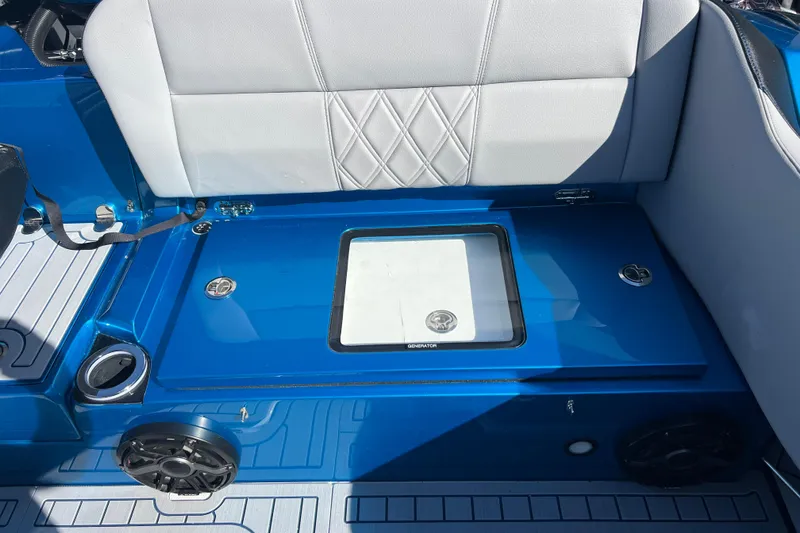 Slide: The Image of 2026 Nor-Tech 450 Sport boat interior with blue and white seating and storage compartment. - 37