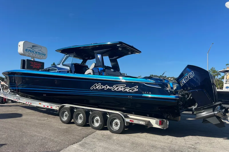 Slide: The Image of 2026 Nor-Tech 450 Sport boat on trailer at Erickson Marine dealership. - 4