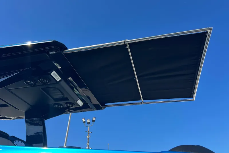 Slide: The Image of Nor-Tech 450 Sport 2026 boat canopy against clear blue sky. - 43