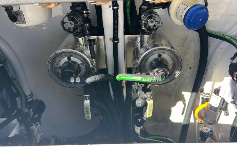 Slide: The Image of Engine compartment of 2026 Nor-Tech 450 Sport boat, showcasing mechanical components and hoses. - 50