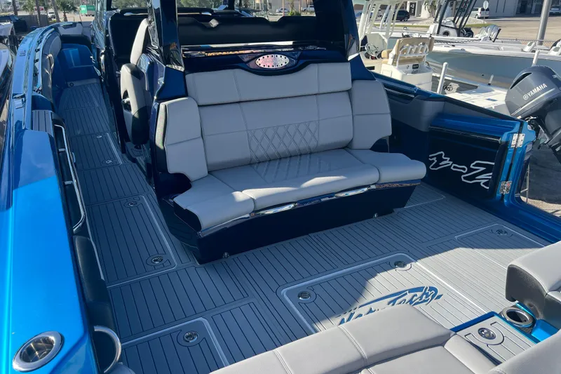 Slide: The Image of 2026 Nor-Tech 450 Sport boat interior with luxurious seating and sleek design. - 9