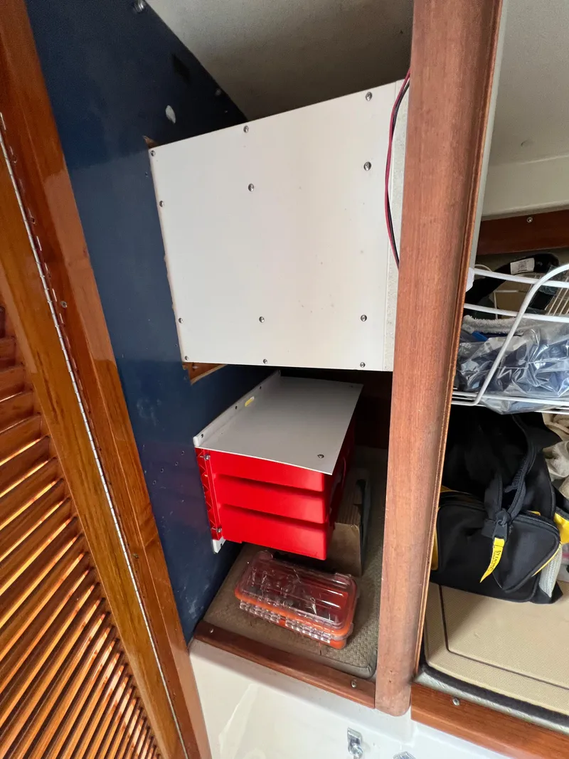 Slide: The Image of Interior of 1984 Bertram 26 Express boat with storage compartments and equipment. - 20