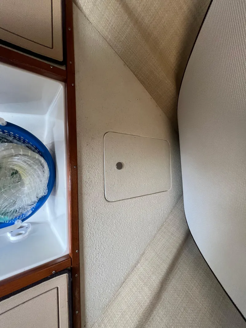 Slide: The Image of Interior view of 1984 Bertram 26 Express boat cabin with storage compartment. - 22