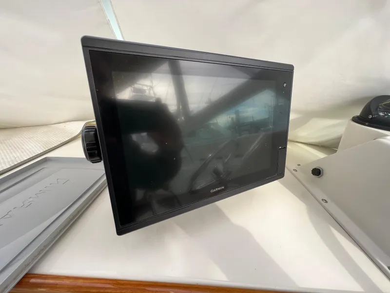 Slide: The Image of Garmin marine display on 1984 Bertram 26 Express boat dashboard. - 27