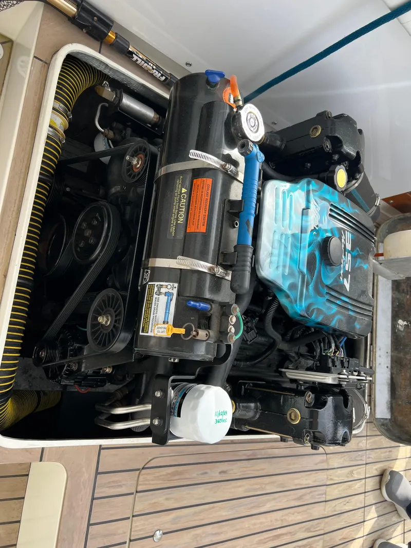 Slide: The Image of 1984 Bertram 26 Express engine compartment with visible components and wiring. - 42