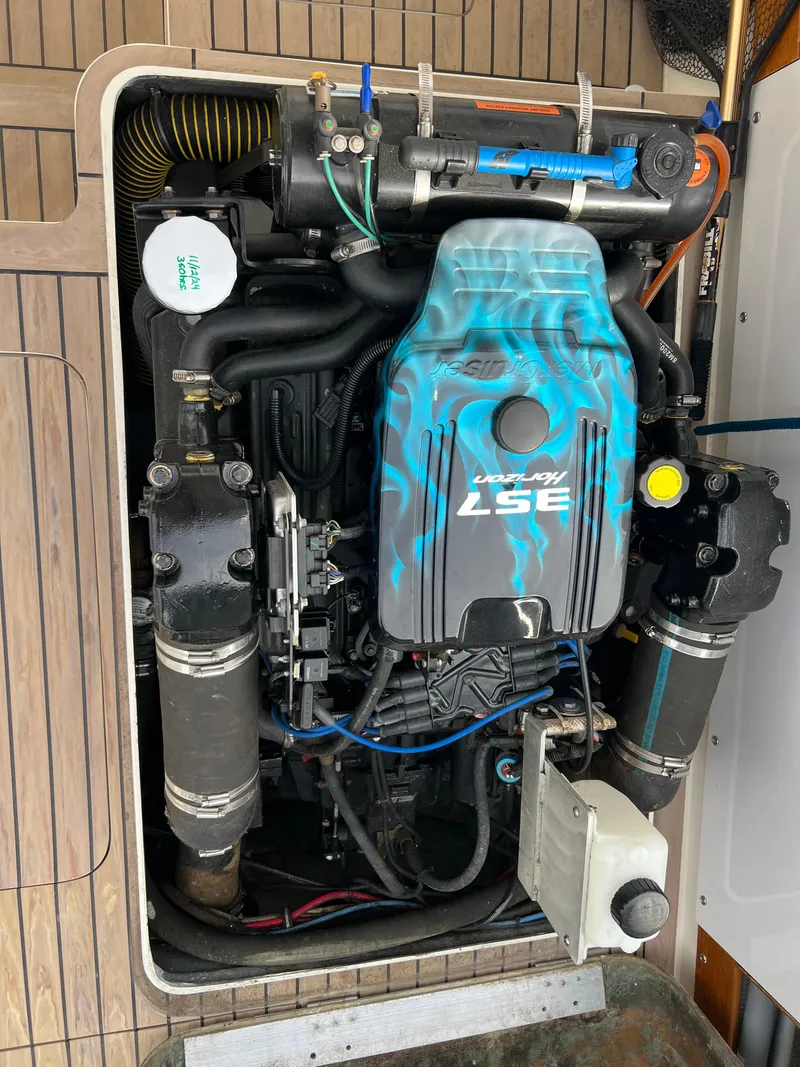 Slide: The Image of 1984 Bertram 26 Express engine compartment with custom-painted 357 engine. - 43