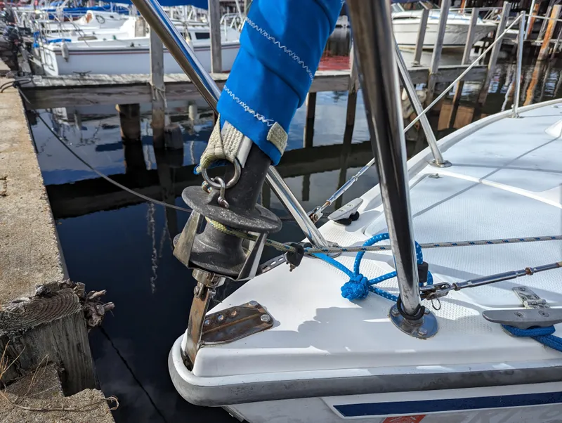 Slide: The Image of 1987 Catalina 25 sailboat docked at marina, close-up of bow and rigging. - 4