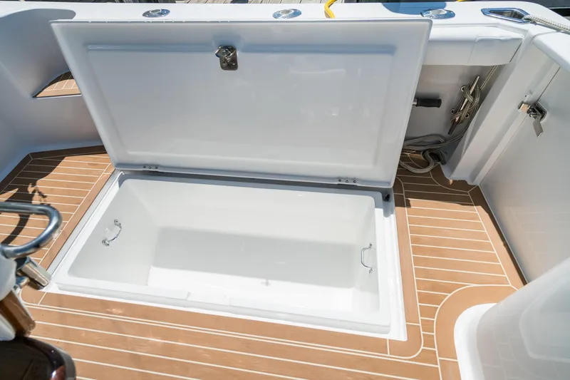 Slide: The Image of Henriques 35 Express 2025 boat with open storage compartment on deck. - 12