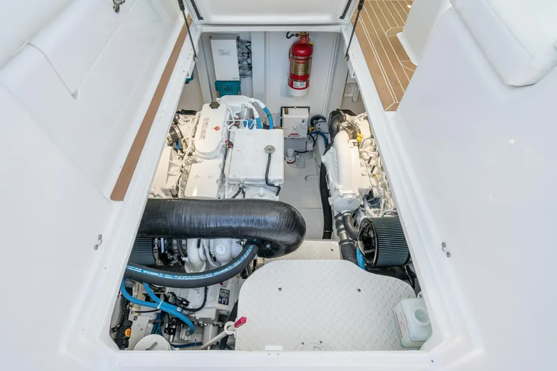 Slide: The Image of Engine room of 2025 Henriques 35 Express boat with visible machinery and fire extinguisher. - 13