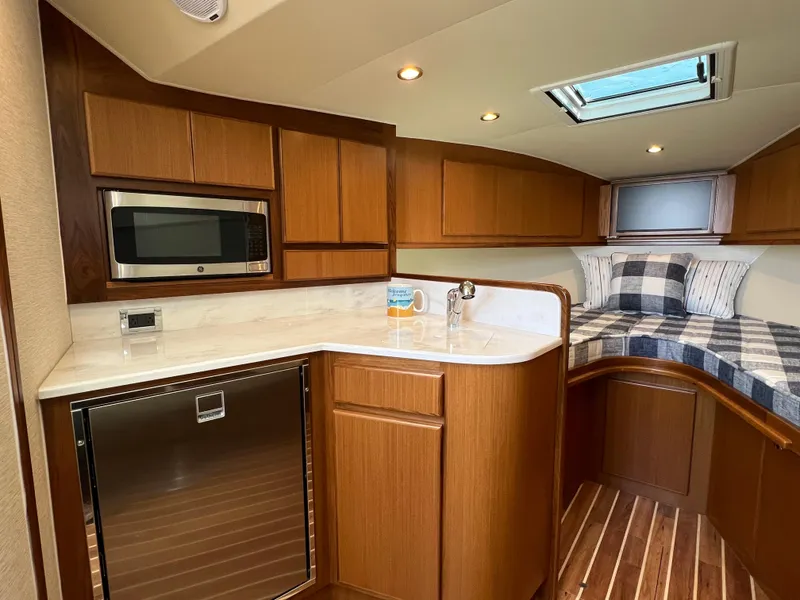Slide: The Image of 2025 Henriques 35 Express cabin with kitchenette and cozy sleeping area. - 15