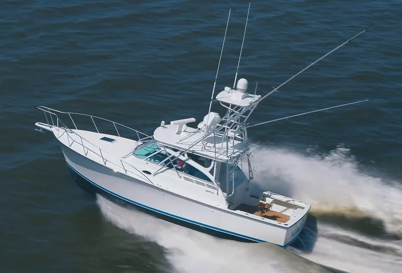 Slide: The Image of 2025 Henriques 35 Express boat cruising on open water. - 3