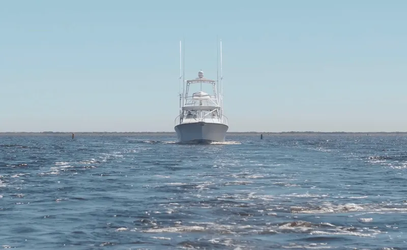 Slide: The Image of Henriques 35 Express 2025 boat cruising on open water. - 5