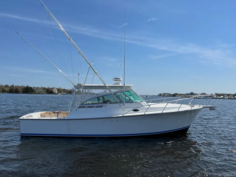 Slide: The Image of 2025 Henriques 35 Express boat on calm water. - 6