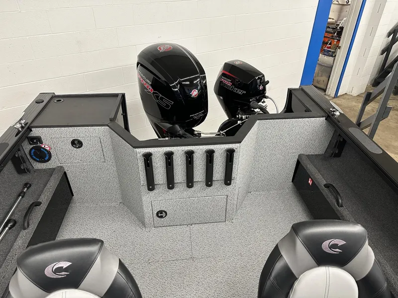 Slide: The Image of 2025 Crestliner 1850 Commander boat interior with dual outboard motors. - 5