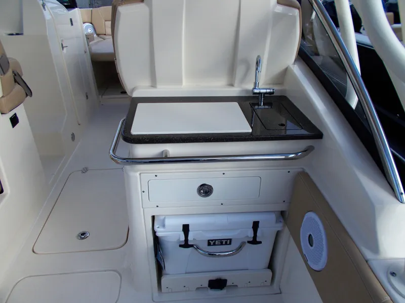 Slide: The Image of Scout 255 Dorado 2026 boat kitchenette with sink and cooler. - 20