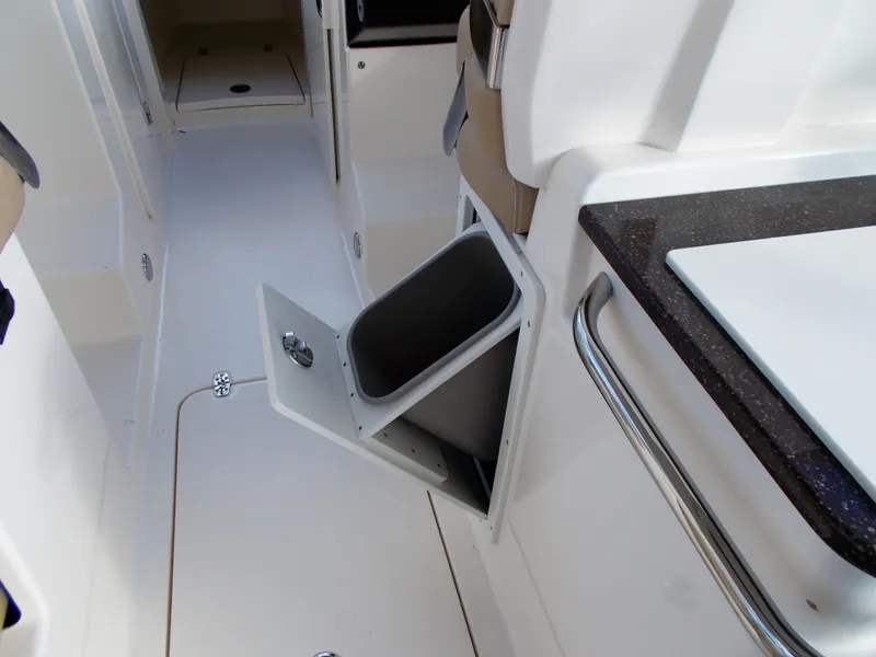 Slide: The Image of Interior of 2026 Scout 255 Dorado with open trash bin. - 23