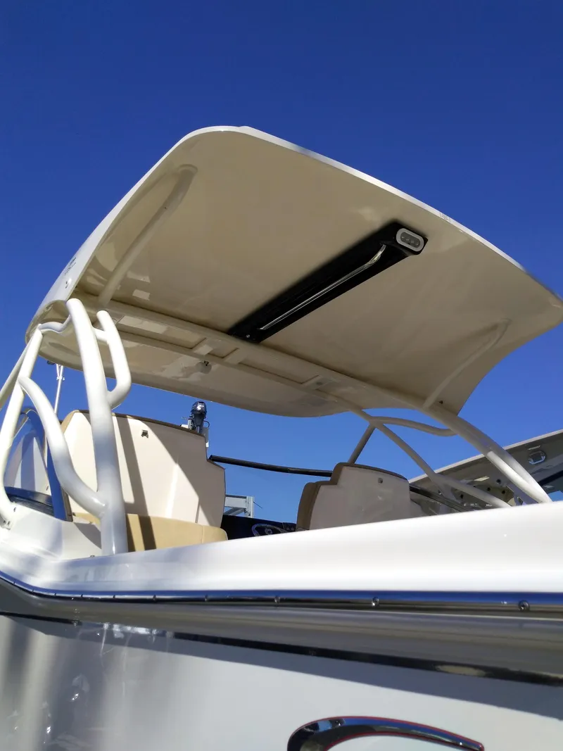 Slide: The Image of Scout 255 Dorado 2026 with sunshade, blue sky. - 28