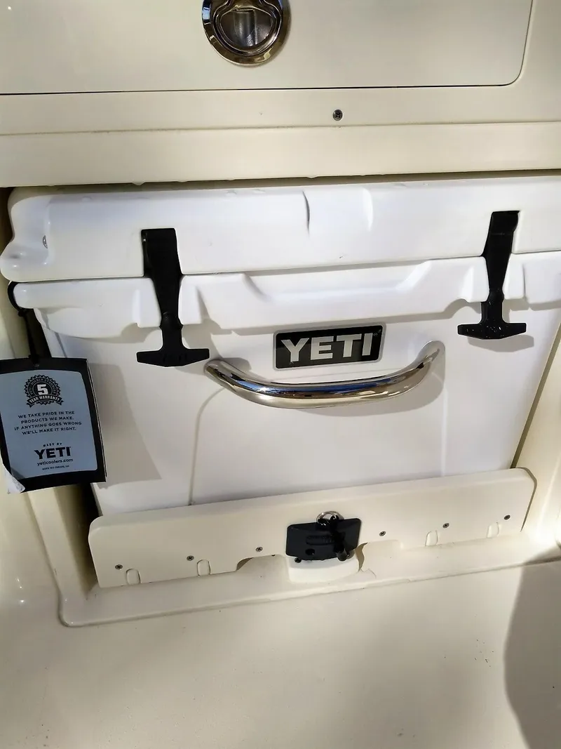 Slide: The Image of YETI cooler on Scout 255 Dorado boat, model 2026. - 30