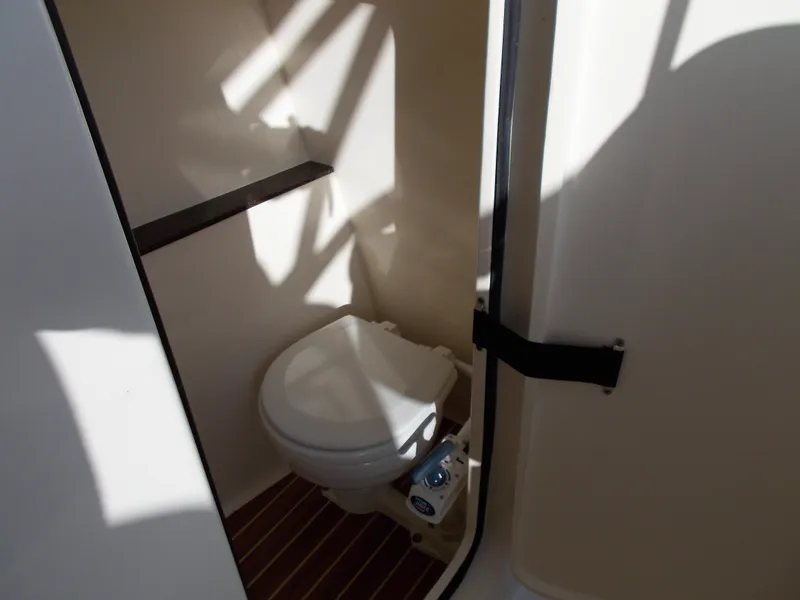Slide: The Image of Interior of 2026 Scout 255 Dorado featuring a toilet. - 7