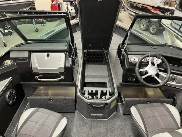 Slide: The Image of Interior of 2025 Lund 2075 Pro V Sport fishing boat with storage compartments open. - 4