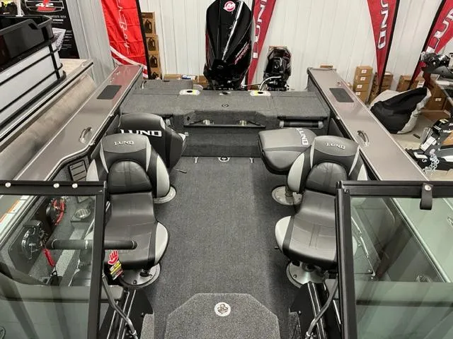 Slide: The Image of 2025 Lund 2075 Pro V Sport boat interior with seating and storage compartments. - 5