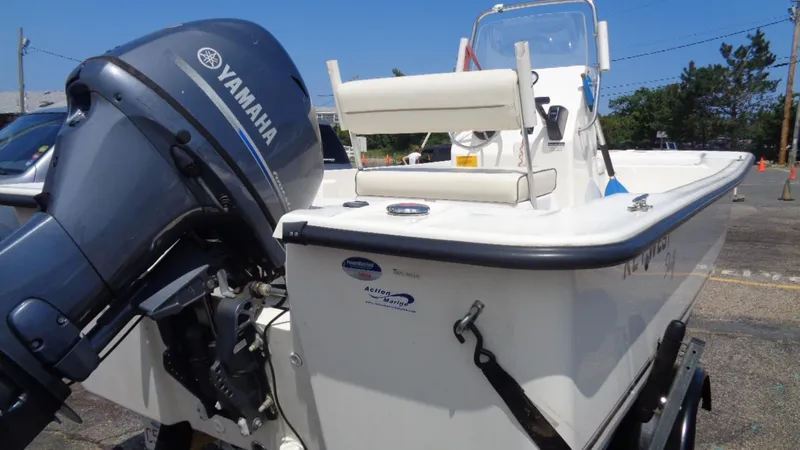 Slide: The Image of 2015 Key West 177 Skiff with Yamaha outboard motor, parked on a trailer. - 5