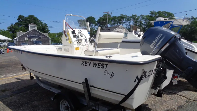 Slide: The Image of 2015 Key West 177 Skiff boat with Yamaha outboard motor on a trailer. - 6