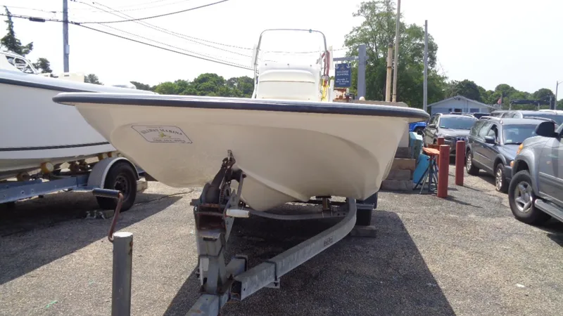 Slide: The Image of 2015 Key West 177 Skiff boat on trailer in outdoor lot. - 9