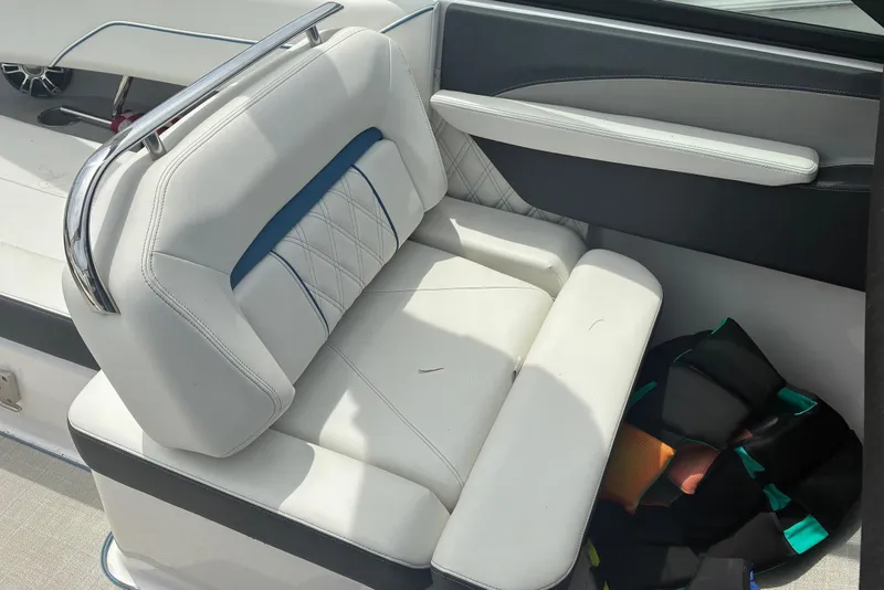 Slide: The Image of White leather seating in a 2020 Regal LS4 boat interior. - 10