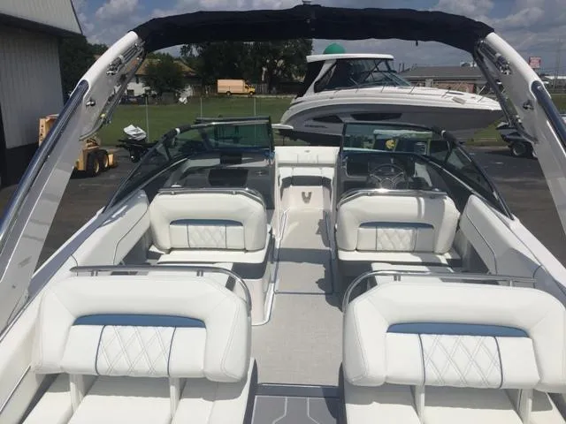 Slide: The Image of Interior view of a 2020 Regal LS4 boat with luxurious white seating. - 16