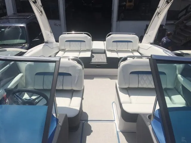 Slide: The Image of Interior view of a 2020 Regal LS4 boat with white seating. - 18