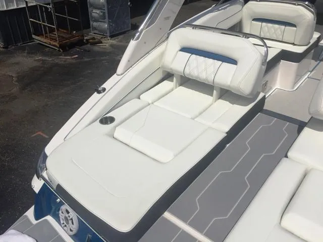 Slide: The Image of 2020 Regal LS4 boat with luxurious white seating and gray flooring. - 19