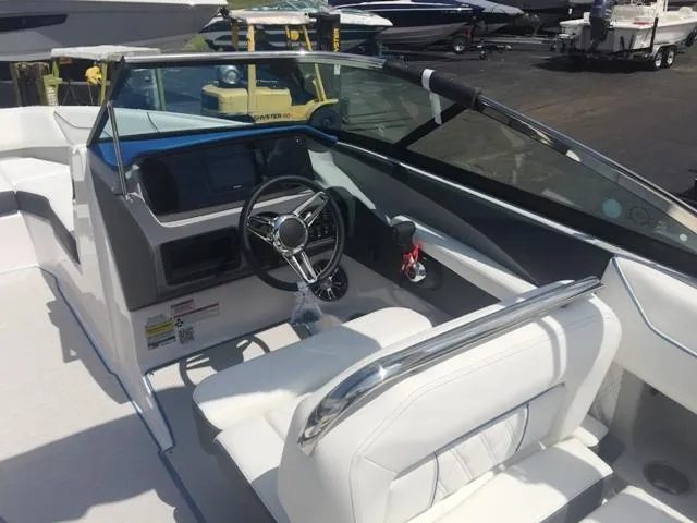 Slide: The Image of Interior of a 2020 Regal LS4 boat with white seating. - 21