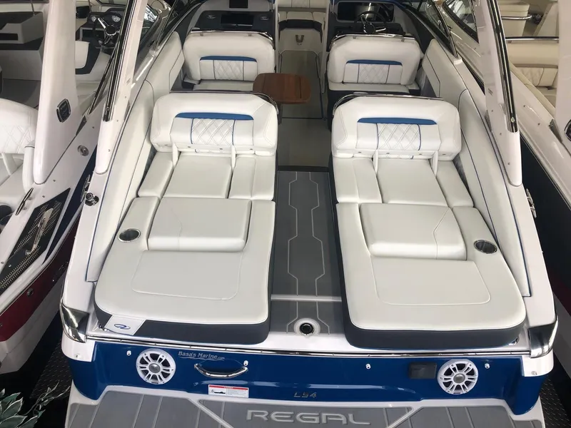Slide: The Image of 2020 Regal LS4 boat with luxurious white seating and modern design. - 26
